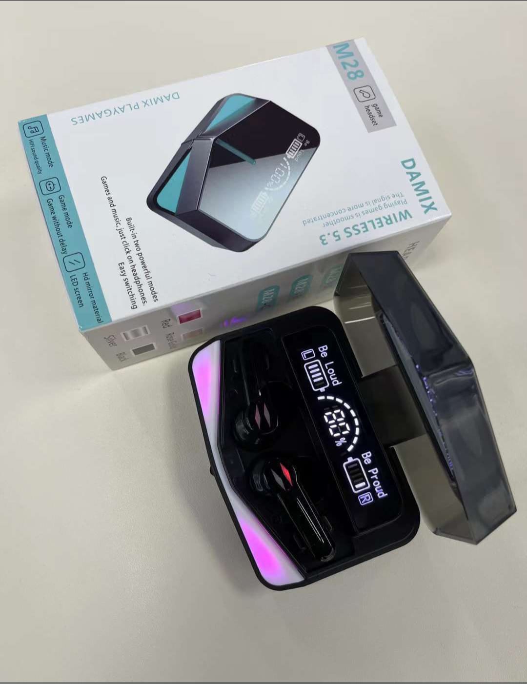 DAMIX M28 earbuds, wireless gaming earbuds, low latency gaming earbuds, dual mode TWS earbuds, Bluetooth 5.3 earbuds, LED display earbuds case, gaming earbuds with game mode, HD sound wireless earbuds, stylish mirror finish earbuds, affordable gaming earbuds Pakistan, thetrendhood.com